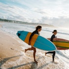 Surfing is a way of living in Australia and young and mature sporty women go surfing every morning.